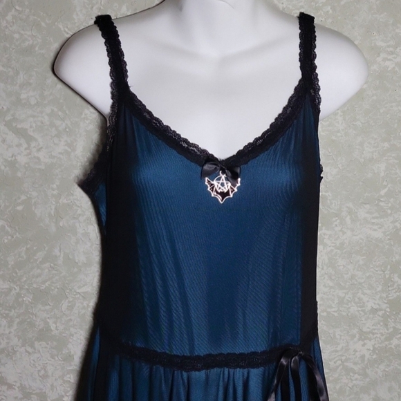 Chic Asymmetrical Teal Dress with Black Trim - Picture 2 of 9